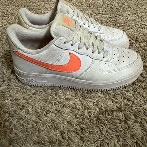 Nike White Low-Top Sneakers with Coral Swoosh